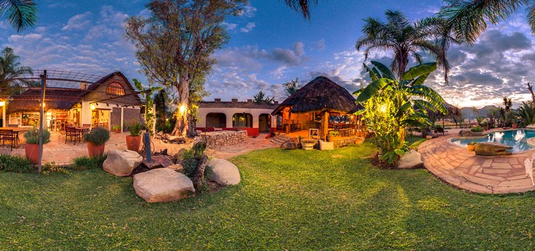 Pool and restaurant facilities of the Gabus Game Ranch Lodge near Otavi at dusk